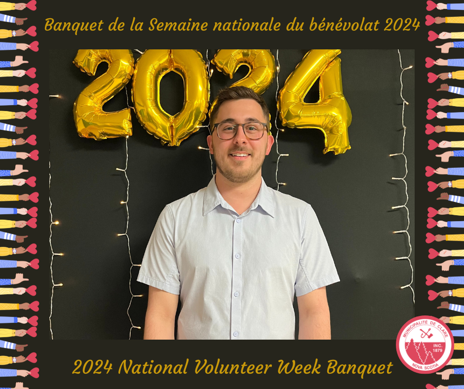 An image of Shane Robicheau, the 2024 Volunteer of the Year in front of a black backdrop with gold 2024 balloons behind him.