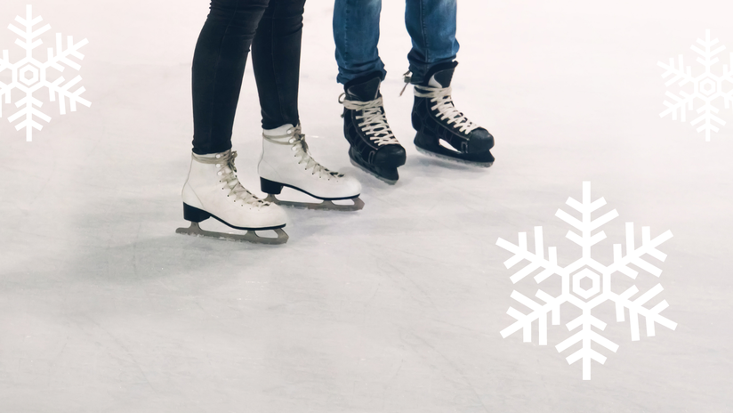 photo of two sets of legs and ice skates on an ice surface